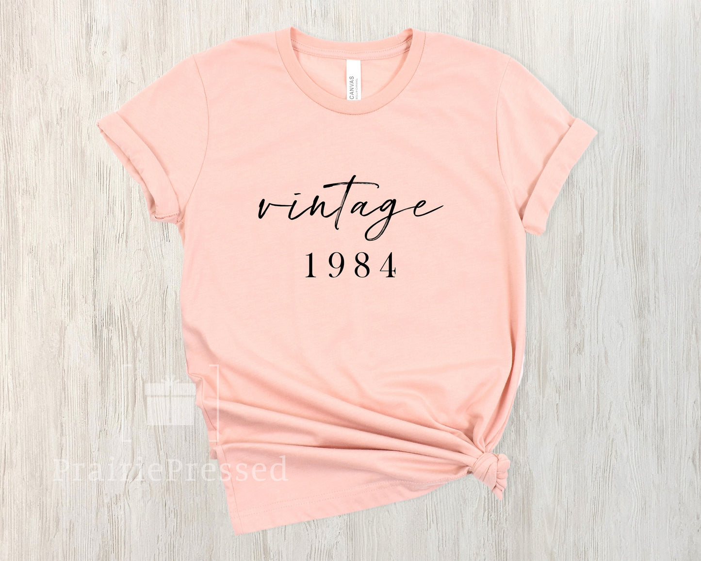 Peach Color Soft Tshirt with the Phrase Vintage 1974 in beautiful font. The Date can be customized for birthday