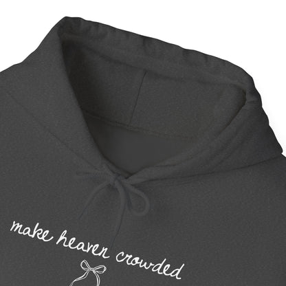 Dark gray hoodie with 'make heaven crowded' text and bow design on a white background