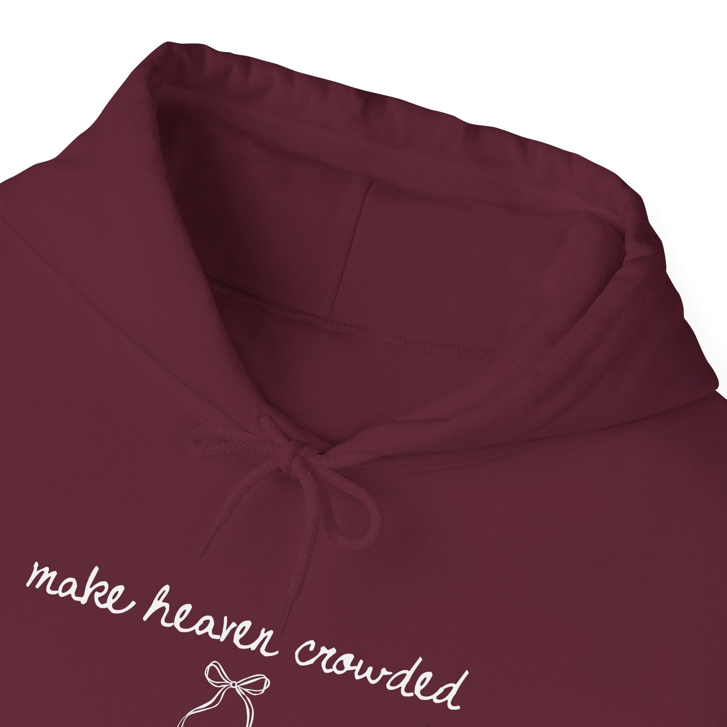 Maroon hoodie with 'make heaven crowded' text and bow design on a white background