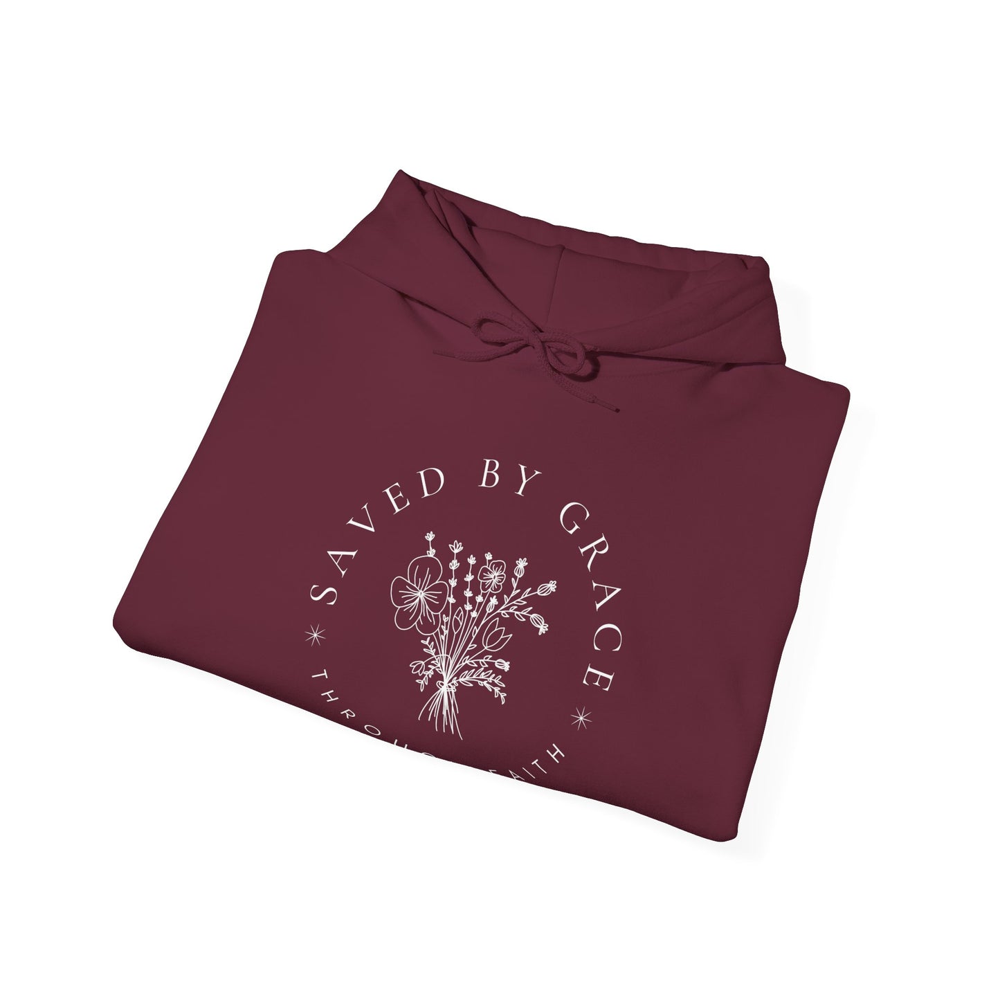 Folded maroon hoodie with 'Saved by Grace' text and floral design on a white background