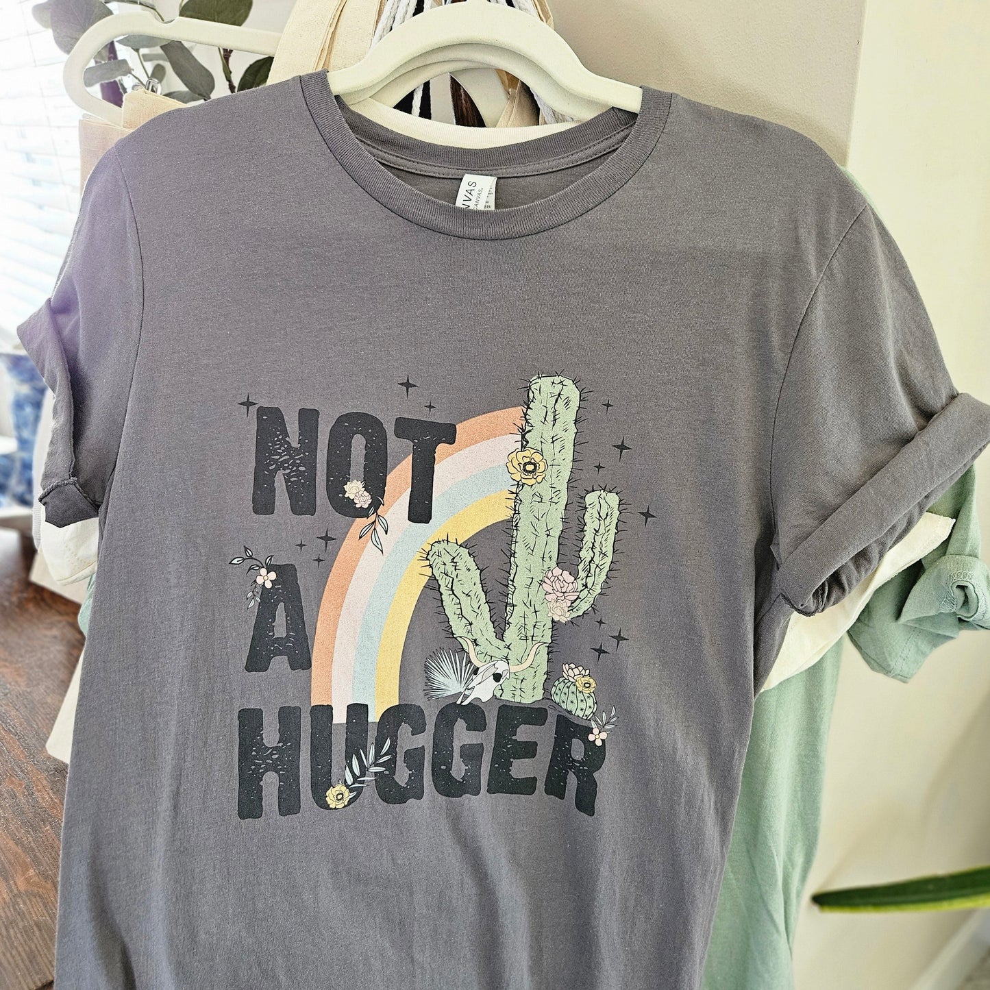 NOT A HUGGER - Medium Bella Canva T Shirt