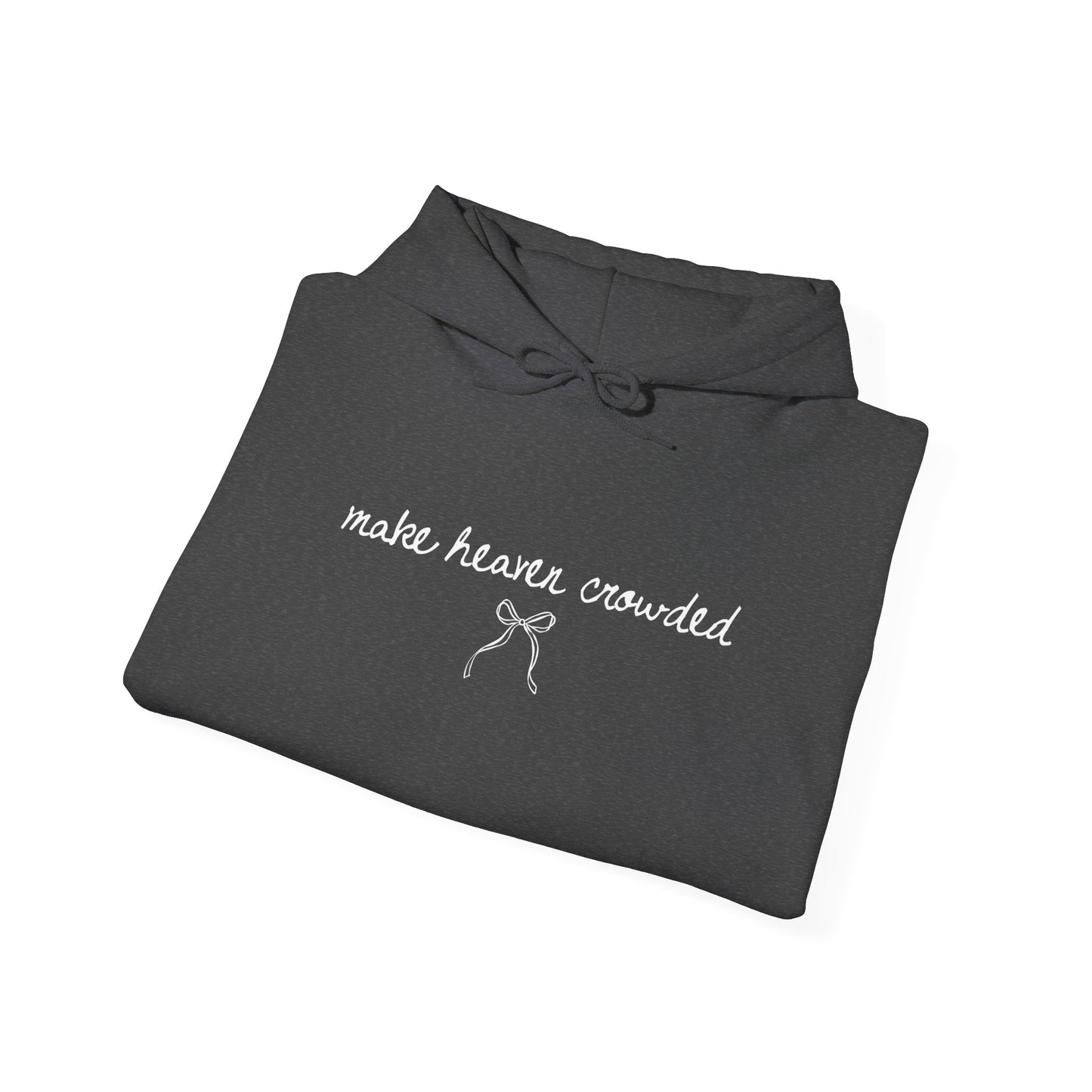 Folded dark gray hoodie with 'make heaven crowded' text on a white background