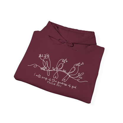 Folded maroon hoodie with white bird and text "I will Sing of the Goodness of God" design and text on a white background