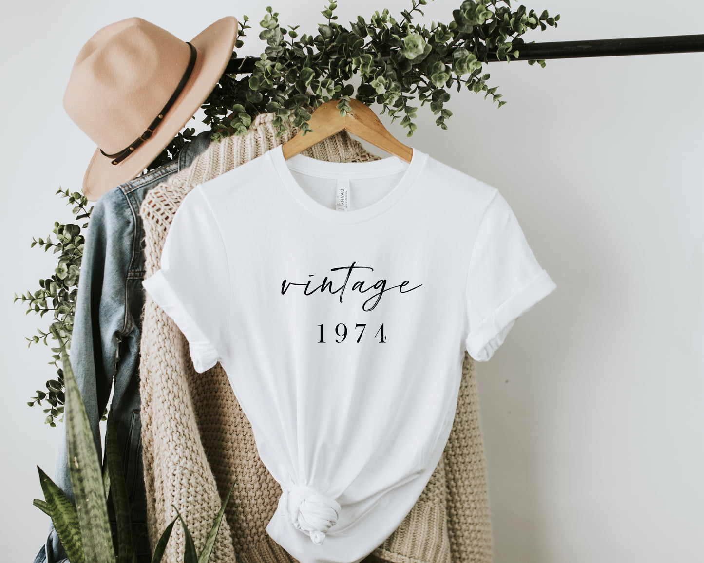 White Color Soft Tshirt with the Phrase Vintage 1974 in beautiful font. The Date can be customized for birthday 